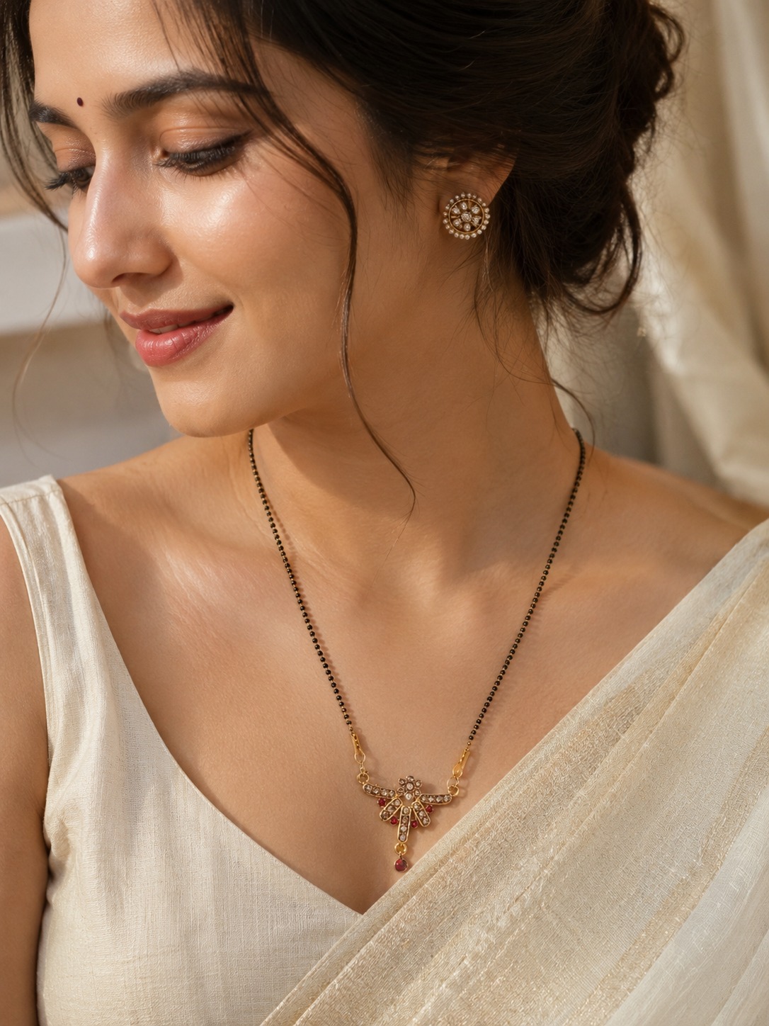 Traditional Ruby Charm Mangalsutra with ruby-inspired pendant, gold-tone finish, and classic black bead chain